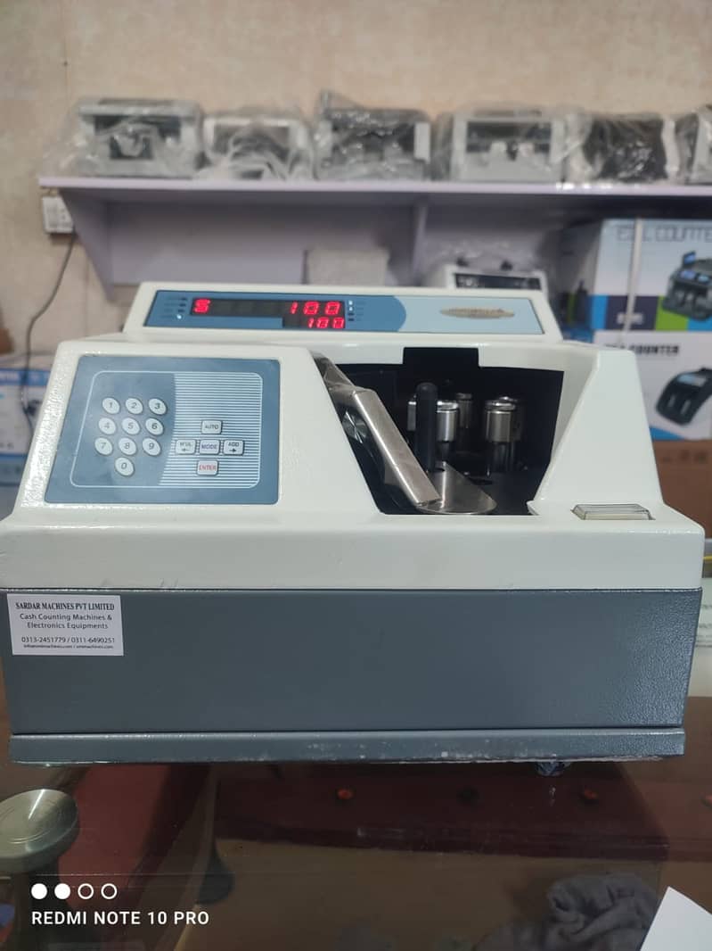 Cash currency note bill counting machine in Pakistan with fake note de 1