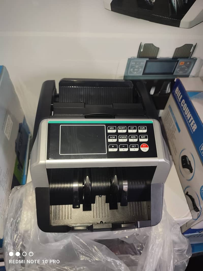 Cash currency note bill counting machine in Pakistan with fake note de 10