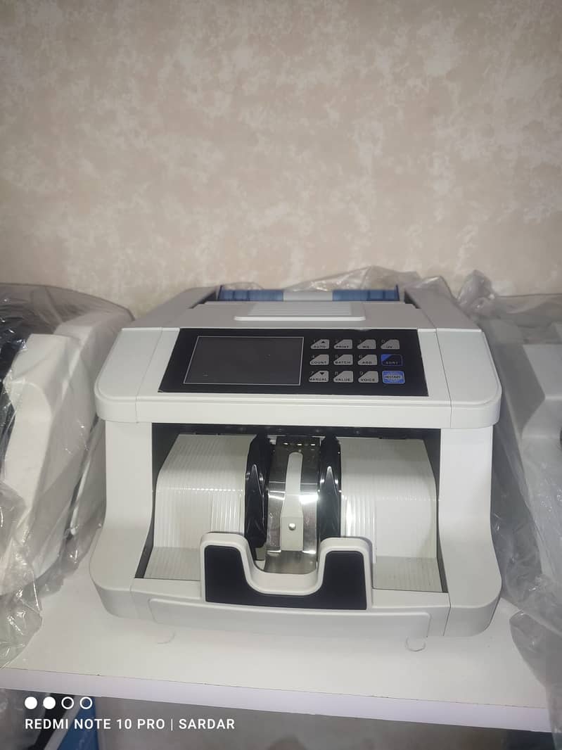 Cash currency note bill counting machine in Pakistan with fake note de 14