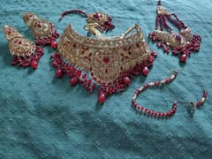 Bridal lehanga with hand pouch and jewellery