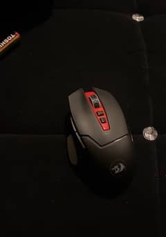 RedDragon m690 mirage wireless gaming mouse with mappable buttons.