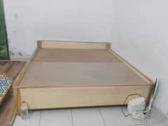 wooden bed in good condition