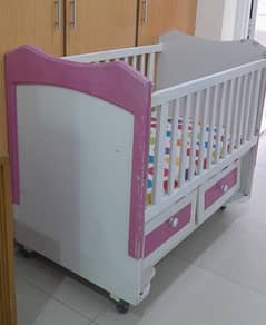 baby crib and almirah