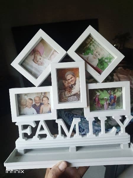 a wall hanging photo frame 0