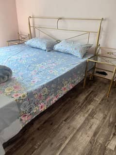 Rot iron bed with two side tables