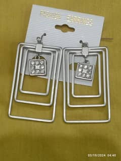 Square shaped silver colour ear rings
