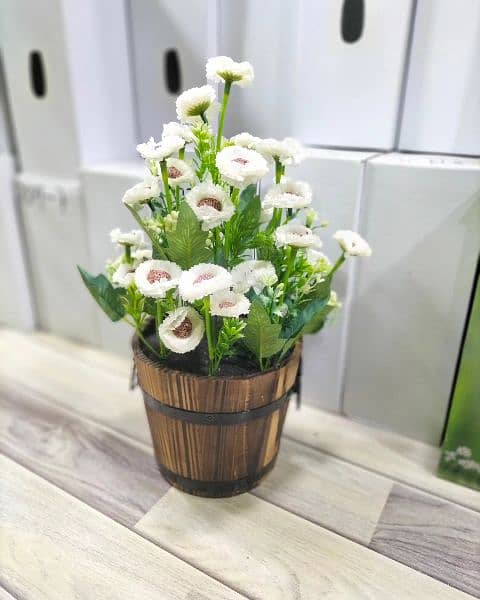 Artificial plants with wooden pot available here 1