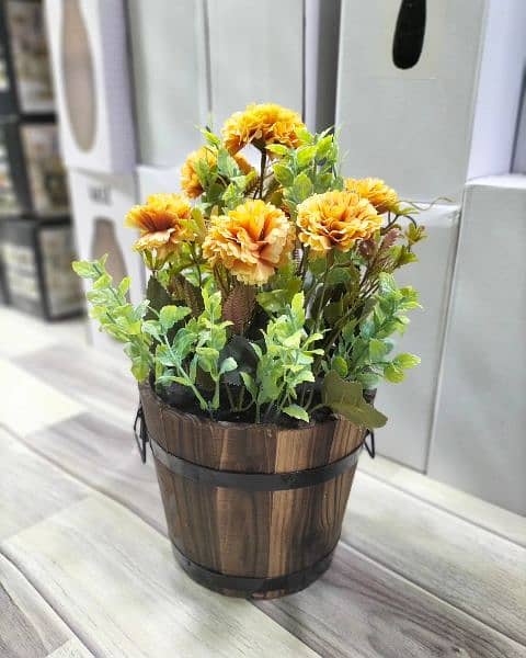 Artificial plants with wooden pot available here 9