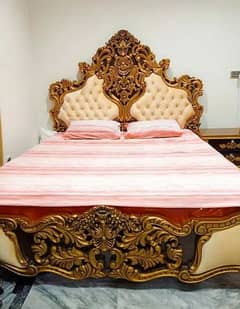 bed with side tables and dressing table