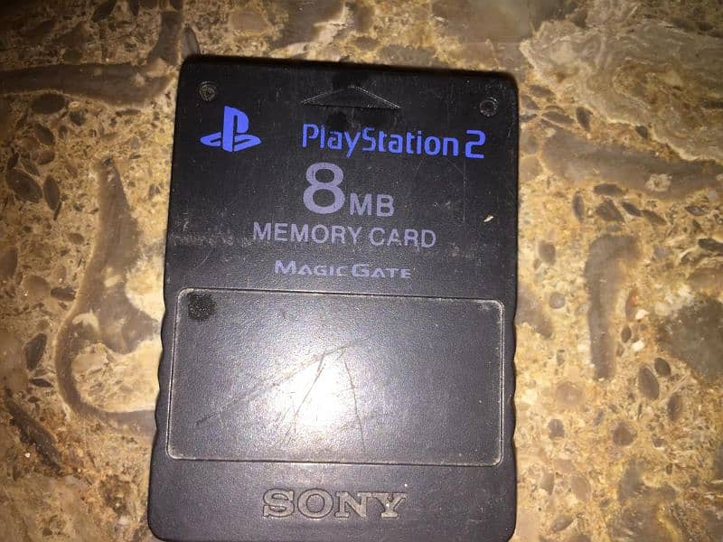 PS2 with hard with 8mb card and Sony remote game 6
