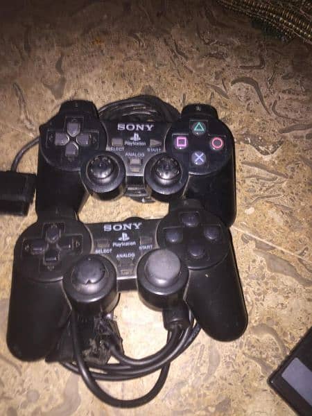 PS2 with hard with 8mb card and Sony remote game 9