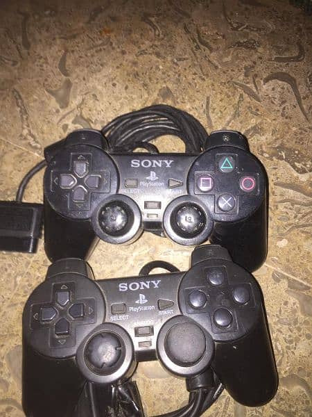 PS2 with hard with 8mb card and Sony remote game 10