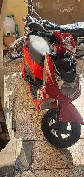 RED COLOUR ELECTRIC SCOOTY 3