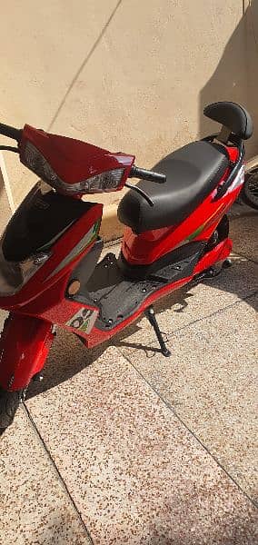 RED COLOUR ELECTRIC SCOOTY 4