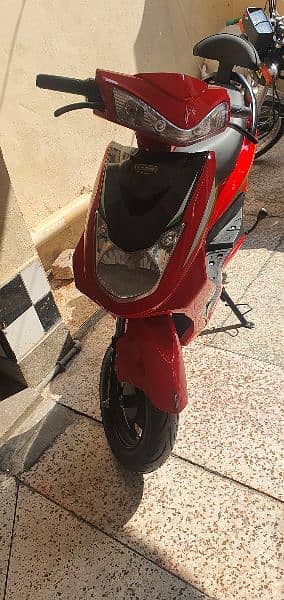 RED COLOUR ELECTRIC SCOOTY 5