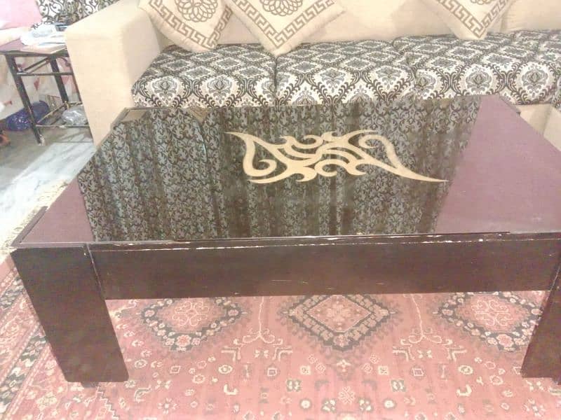L shape sofa in good condition  and beautiful table and cushions 2