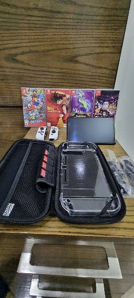 Nintendo Switch Oled + 4 Games + Original Box & Accessories 0