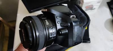 Nikon D5200 dslr with 2 lenses and bag strap