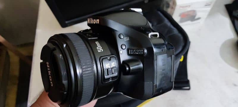 Nikon D5200 dslr with 2 lenses and bag strap 0