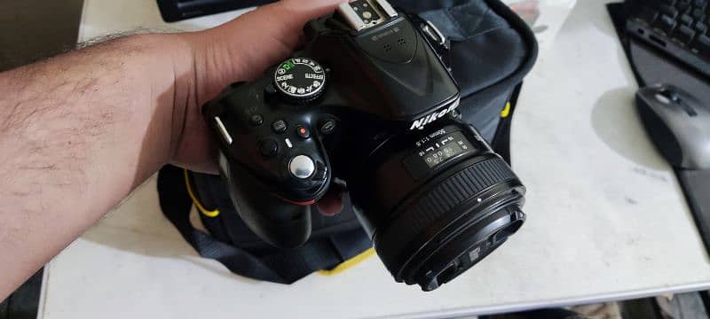 Nikon D5200 dslr with 2 lenses and bag strap 1