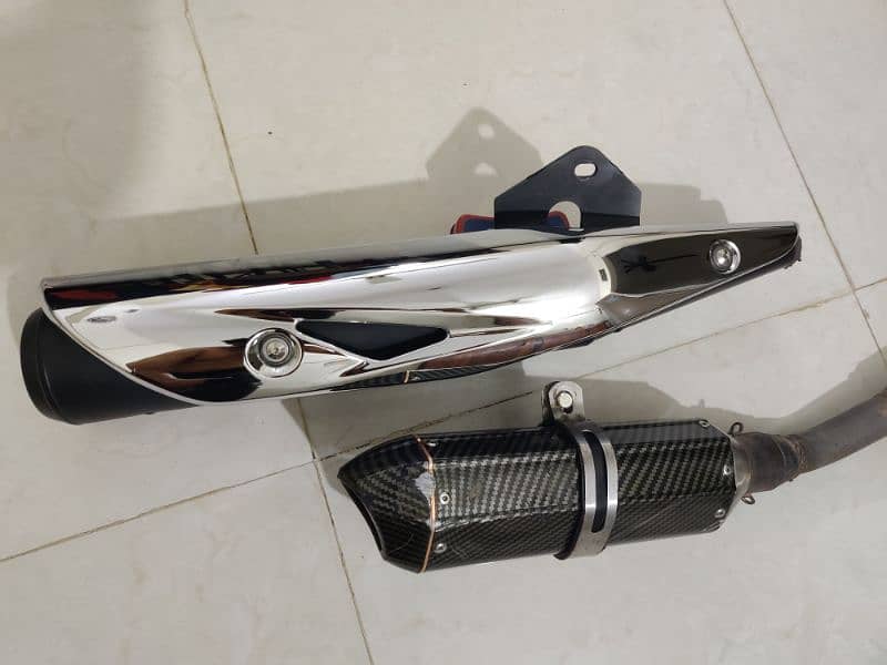 Suzuki gr150 original silencer with Akrapovic exhaust 2