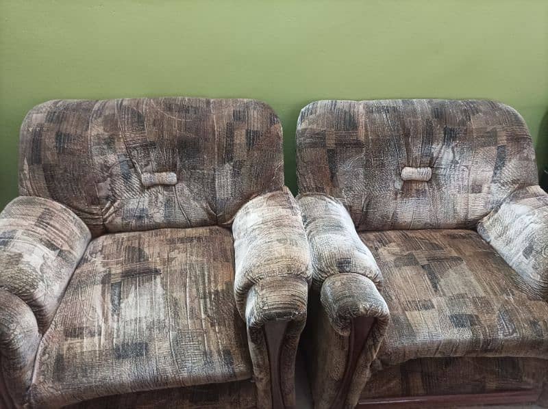 5 seater brown textured sofa set . 1