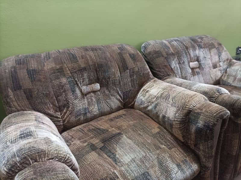 5 seater brown textured sofa set . 3