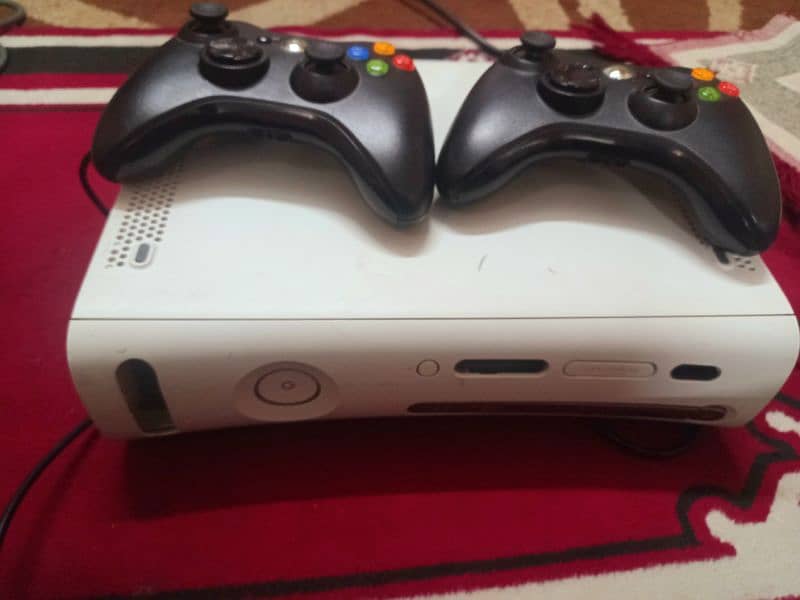 xbox 360 with 2 controllers and box 0
