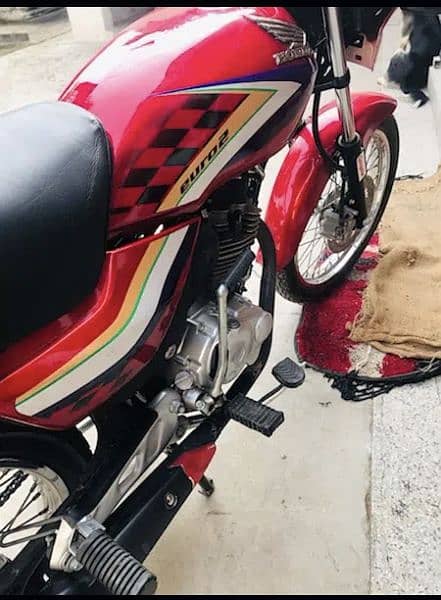 Honda Deluxe Red in lush Condition only wats app 0