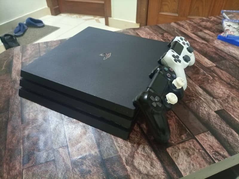 Imported Ps4 console with two controllers + three games 1