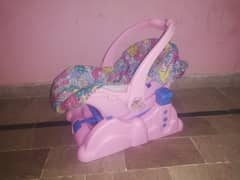 Baby's carry cot in pink color