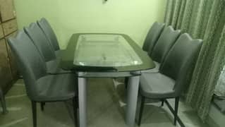 imported glass top metal dining table with 6 metal chairs set.