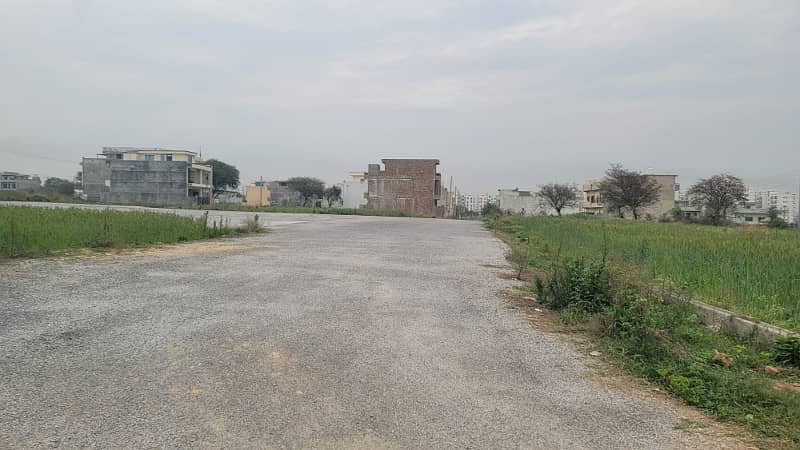 8 Marla level plot Near to Markaz and Central park on Main Double Road and Access Road to Airport for Sale 9