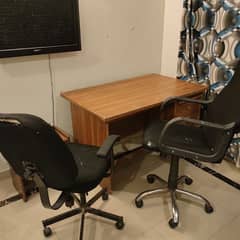 Two Office rolling chairs. witb wooden table