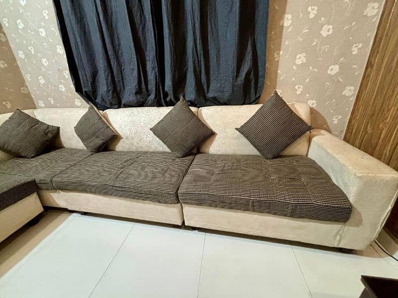 8 Seater sofa L shaped in decent condition 1