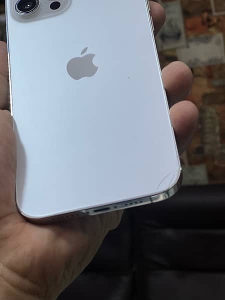 iphone 12 promax 128gb back minor crack 4 months sim time available 8