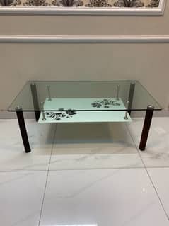 Tempered glass center table with wodden legs