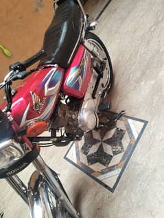 M selling Honda 125 red color urgent sell.