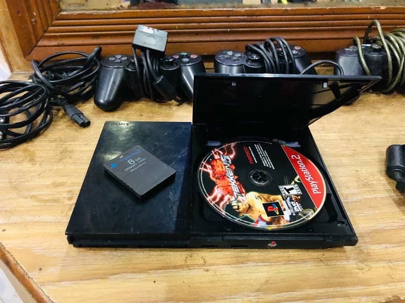 Play station 2 with tekken cd and 3 controller 1