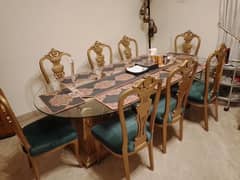 8 seater glass top Dining table with elegant chairs