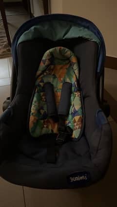 baby shop car seat and carrying cot