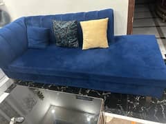 Blue L shape sofa with center table