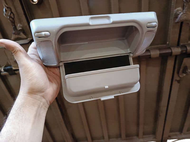 universal car roof light with glasses hanging. 0