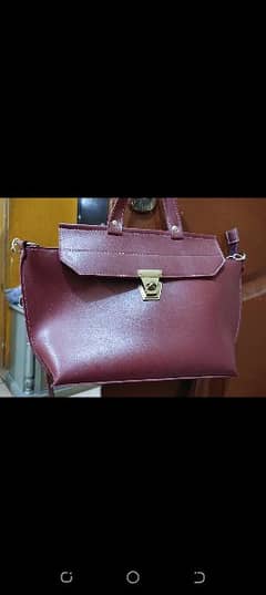 ladies bag for sale in maroon color, available in reasonable price 0