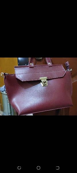 ladies bag for sale in maroon color, available in reasonable price 1