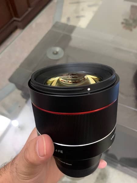 samyang 85 1.4  EF Lens for sony condition just box open 1  time used 6
