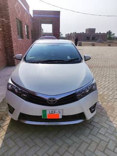 Toyota Gli 2015 White Lahore Reg. Total Genuine