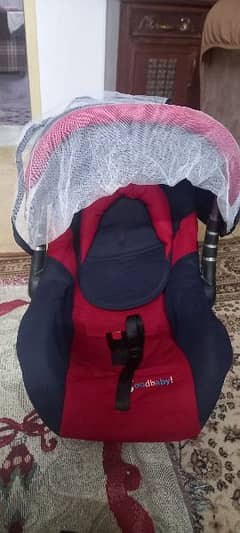 baby cot and car seater
