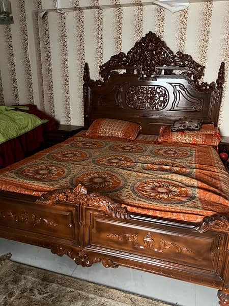 King size bed with wooden chairs set and table 1
