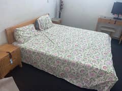 one queen size bed with 2 side tables and 1 dressing table